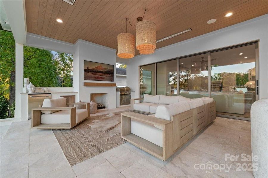 Covered outdoor living space with Isokern ventless fireplace, In-ceiling heaters and Integrated AV system. Covered outdoor living space with Isokern ventless fireplace, In-ceiling heaters and Integrated AV system.