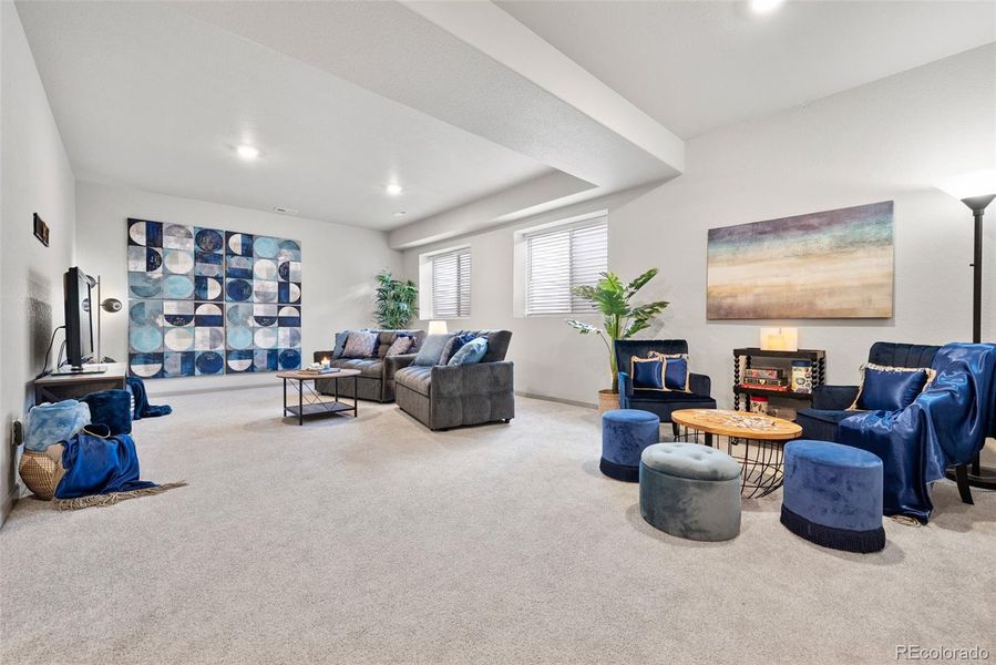 Already plumbed for a wet bar, lower level features a spacious main area plus a big bedroom and full bath.