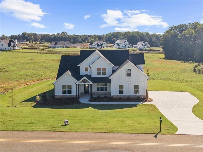 Front exterior of a new home in , Cumming, GA, highlighting curb appeal (Image 29).