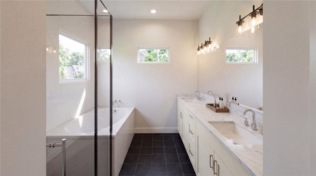 Bathroom featuring a built-in tub with a glass enclosure, dual vanities with integrated sinks, and dark tile flooring