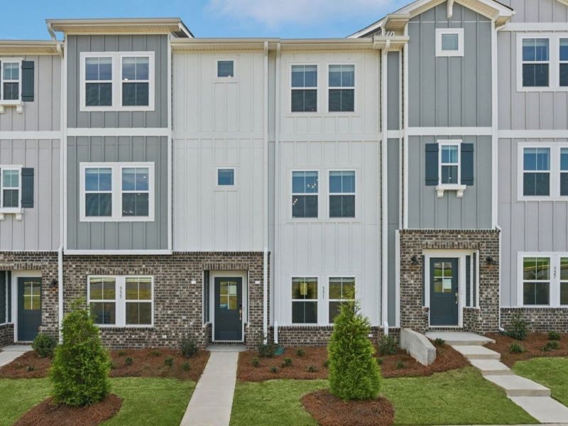 Front exterior of a new home in Meadows at Wilson Farms - The Heights Series, Fort Mill, SC, highlighting curb appeal (Image 1). Front exterior of a new home in Meadows at Wilson Farms - The Heights Series, Fort Mill, SC, highlighting curb appeal (Image 1).