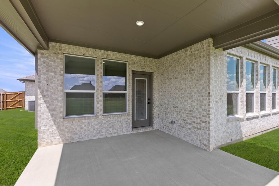 Exterior details and patio area of a home in Coyote Crossing, Godley (Image 3). Exterior details and patio area of a home in Coyote Crossing, Godley (Image 3).