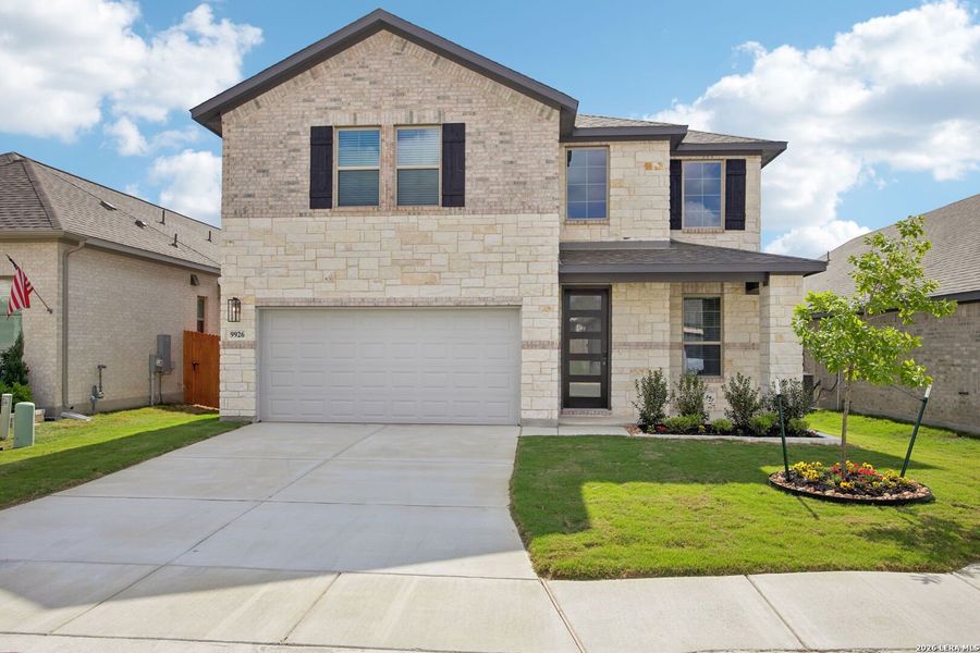 Front exterior of a new home in Kallison Ranch, San Antonio, TX, highlighting curb appeal (Image 2). Front exterior of a new home in Kallison Ranch, San Antonio, TX, highlighting curb appeal (Image 2).