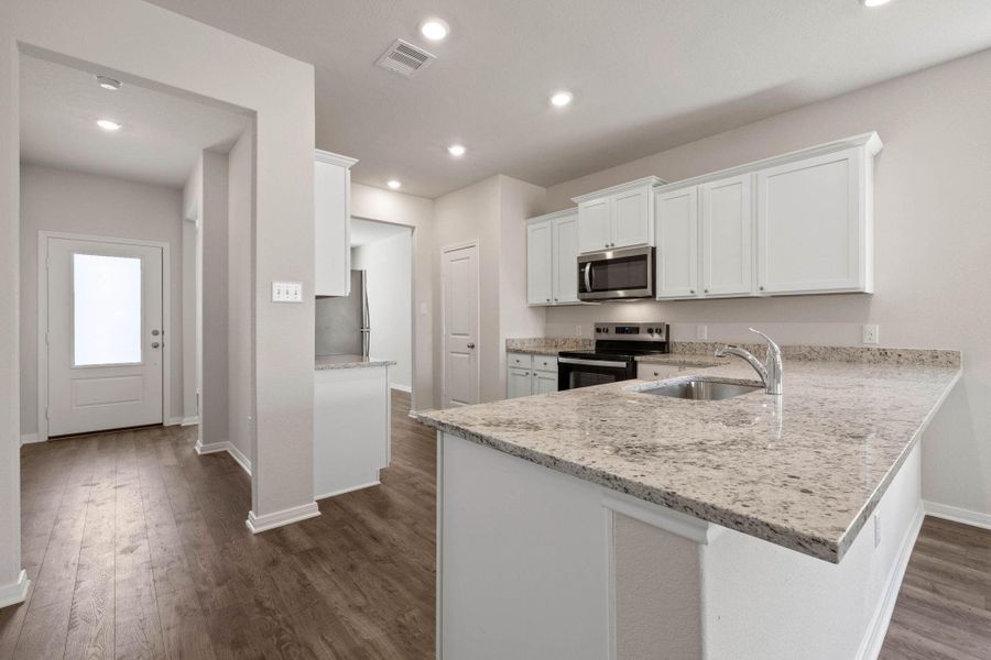 Furnished interior view inside a new home in Vacek Country Meadows, Richmond (Image 5).