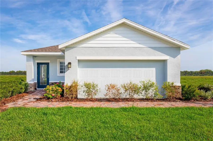 Front exterior of a new home in Cypress Ridge Ranch, Wimauma, FL, highlighting curb appeal (Image 1). Front exterior of a new home in Cypress Ridge Ranch, Wimauma, FL, highlighting curb appeal (Image 1).