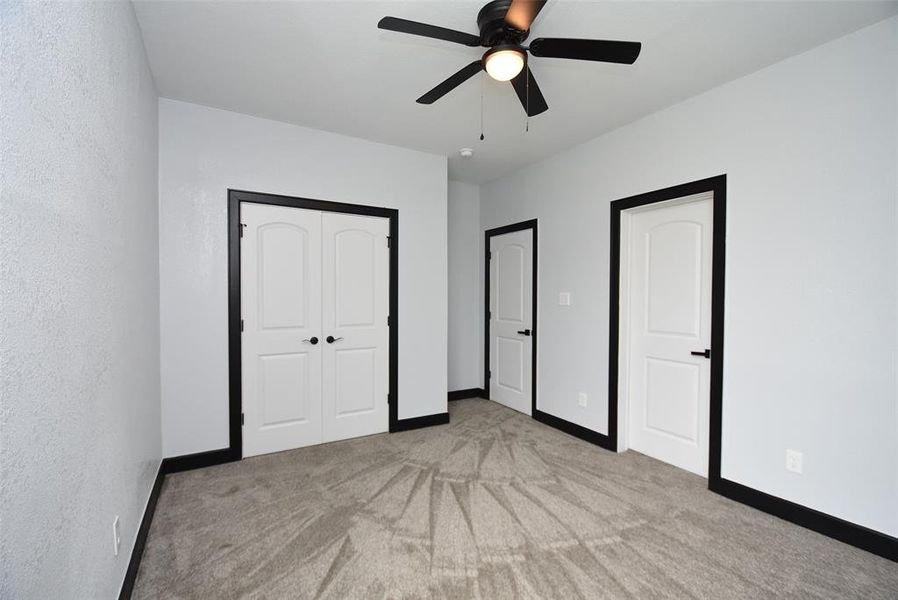 This good-sized room comes with a double-door closet and a fan and shares a full bathroom with another room.