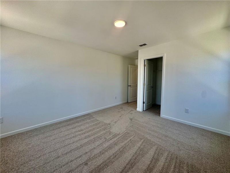 Spacious, unfurnished interior of a new home in Eastlyn Crossing, Flowery Branch (Image 26).