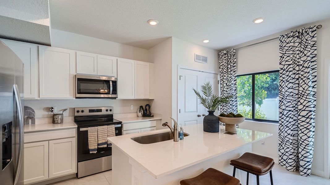 Representative furnished interior of a home built from the Topaz by D.R. Horton in Ashwood Cove, Lake Worth (Image 7).