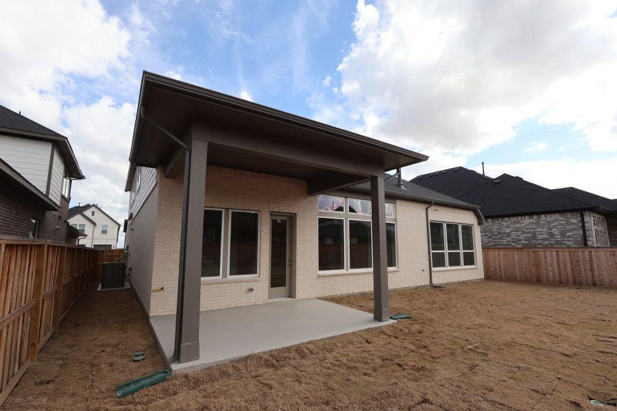 Exterior details and patio area of a home in Dunham Pointe, Cypress (Image 23). Exterior details and patio area of a home in Dunham Pointe, Cypress (Image 23).
