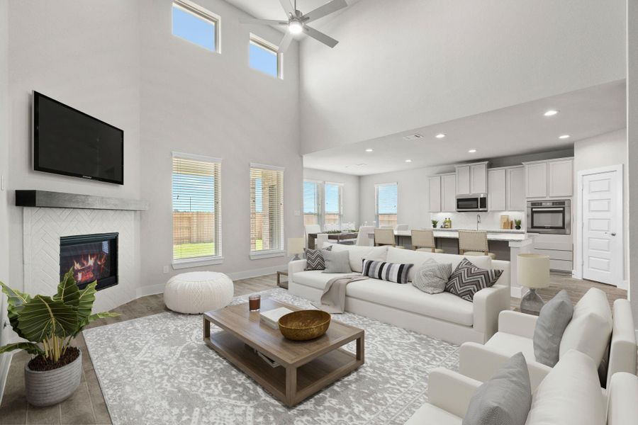 VS. Family Room. Welcome family and guests to your charming living room! With its high ceilings, recessed lighting, ceiling fan, custom paint, beautiful flooring, and large windows that let in abundant natural light, this room is perfect for gatherings. Sample photo of completed home with similar floor plan. Actual colors and selections may vary.