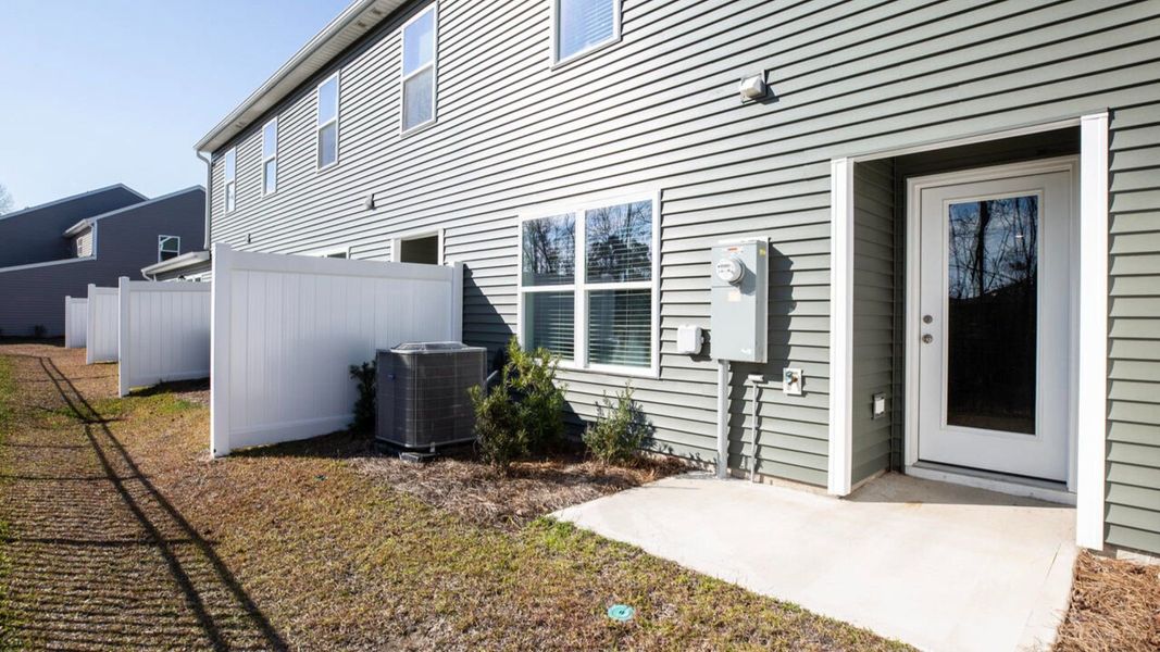 Exterior details and patio area of a home in Waterside Townhomes, Surf City (Image 3). Exterior details and patio area of a home in Waterside Townhomes, Surf City (Image 3).