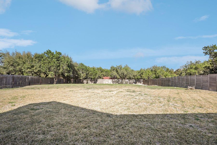 View of fenced backyard