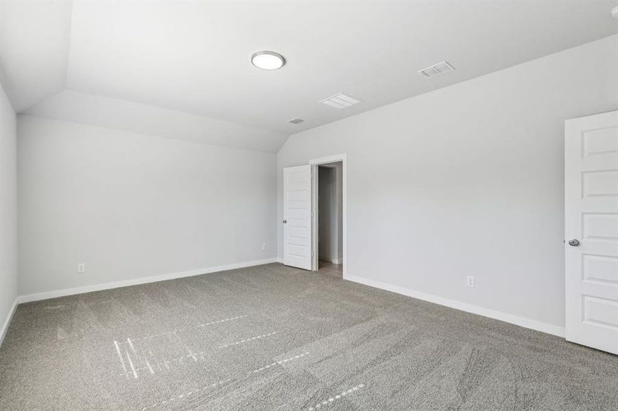 Primary Suite in the Oscar home plan by Trophy Signature Homes – REPRESENTATIVE PHOTO