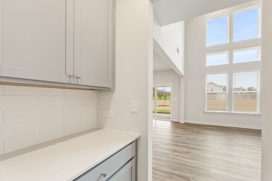 A kitchen with white cabinets. A kitchen with white cabinets.