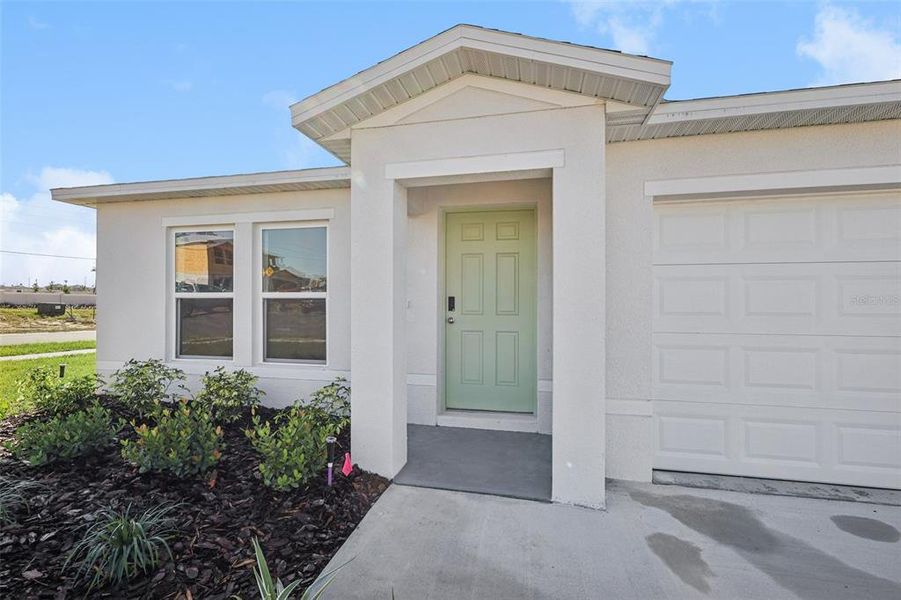 Exterior details and patio area of a home in The Enclave at Scenic Terrace, Haines City (Image 6).
