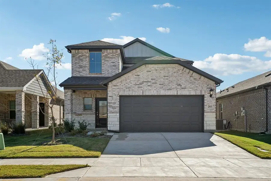 Front exterior of a new home in Southridge - Spring Series, McKinney, TX, highlighting curb appeal (Image 2).