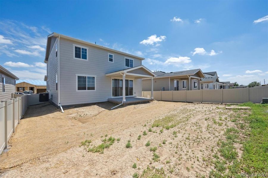 Front exterior of a new home in Vista West, Keenesburg, CO, highlighting curb appeal (Image 1).
