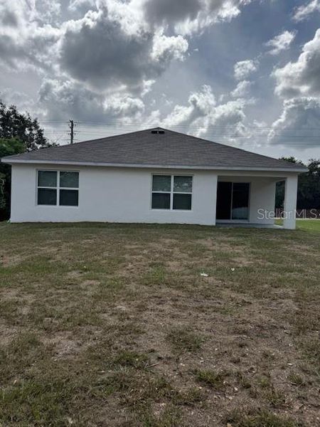Exterior details and patio area of a home in Hernando County Spot Lots, Spring Hill (Image 25).