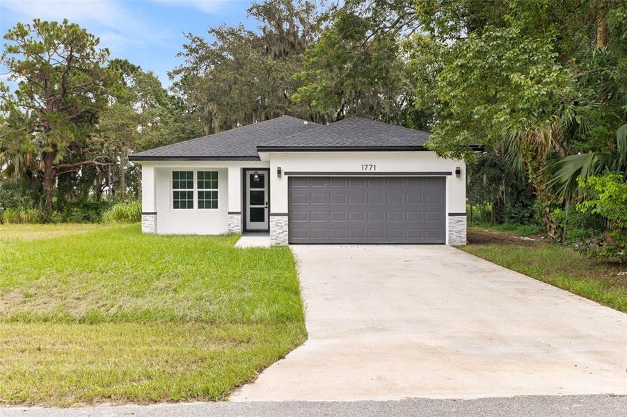 Front exterior of a new home in , Sanford, FL, highlighting curb appeal (Image 1). Front exterior of a new home in , Sanford, FL, highlighting curb appeal (Image 1).