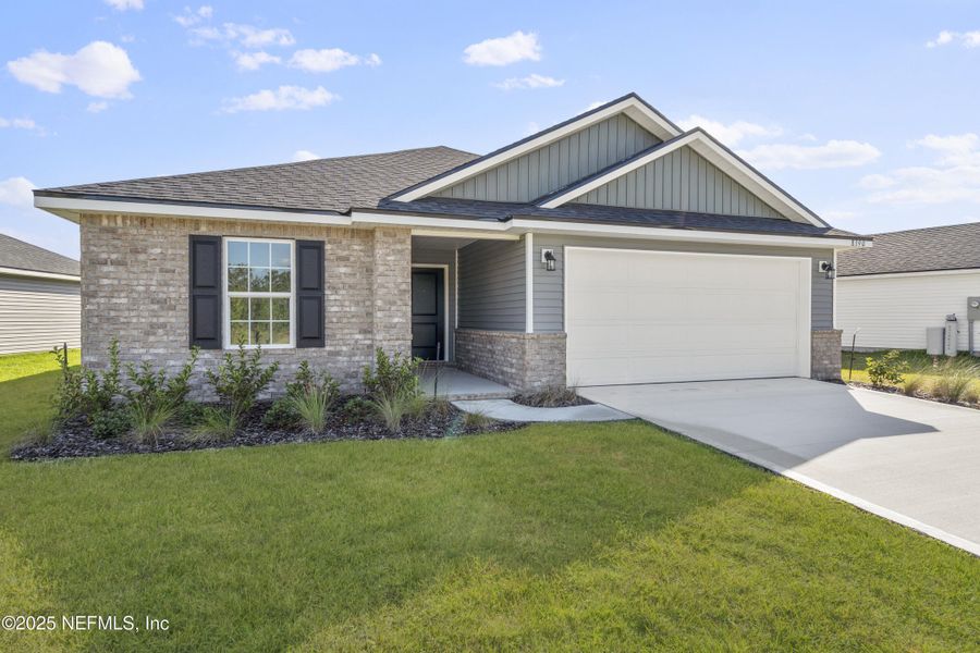 Front exterior of a new home in Summerglen, Jacksonville, FL, highlighting curb appeal (Image 17).