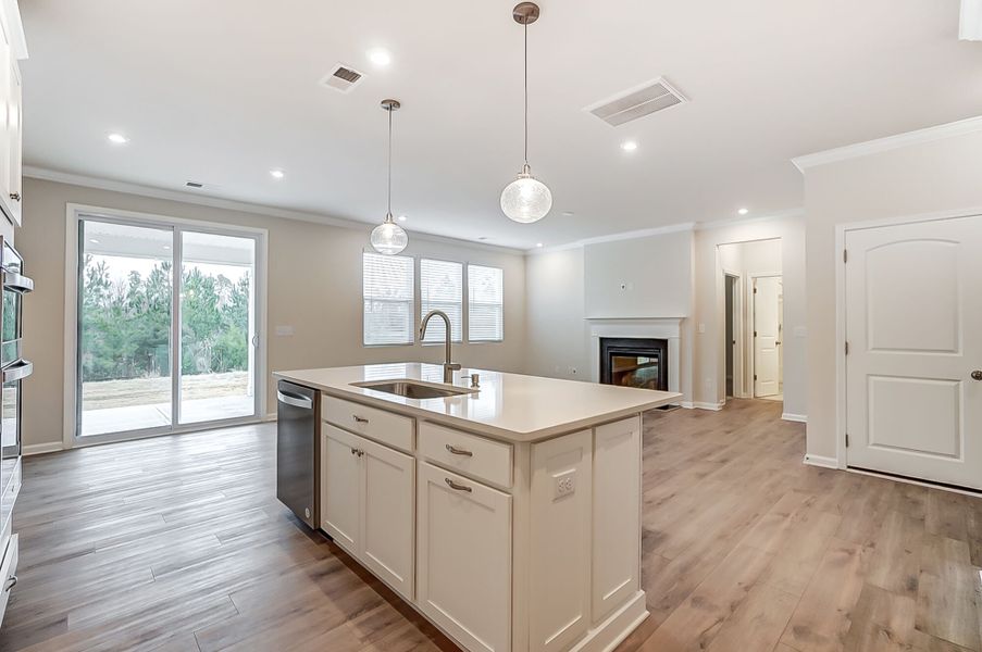 Kitchen and gathering room with door to covered veranda