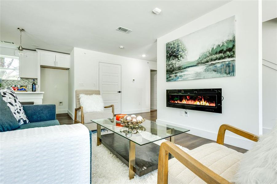 Living room with light hardwood / wood-style floors