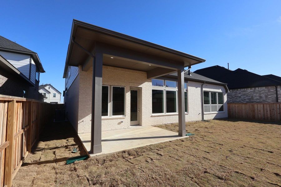 Exterior details and patio area of a home in Dunham Pointe, Cypress (Image 21). Exterior details and patio area of a home in Dunham Pointe, Cypress (Image 21).