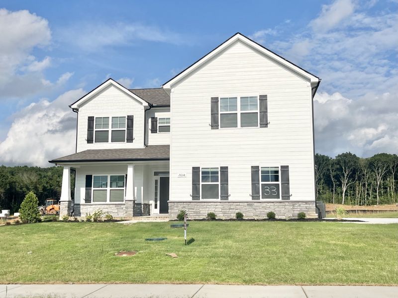 Wonderful 4 bedroom home with full sod , primary down and large covered back porch with fireplace!