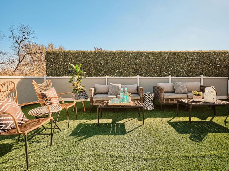 View of grassy yard with a patio