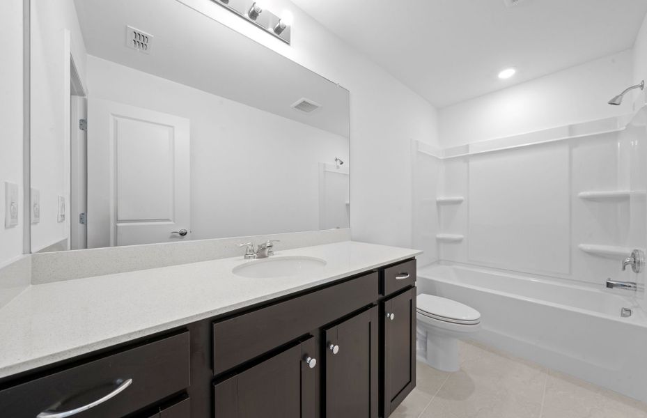 Furnished interior view inside a new home in Whispering Lakes, Lehigh Acres (Image 9).