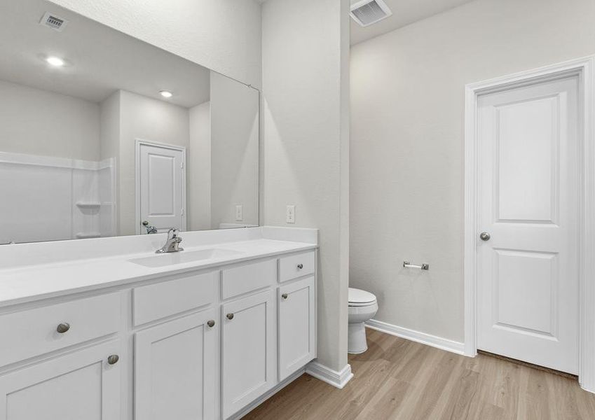 Mater bathroom with a large vanity and tons of storage