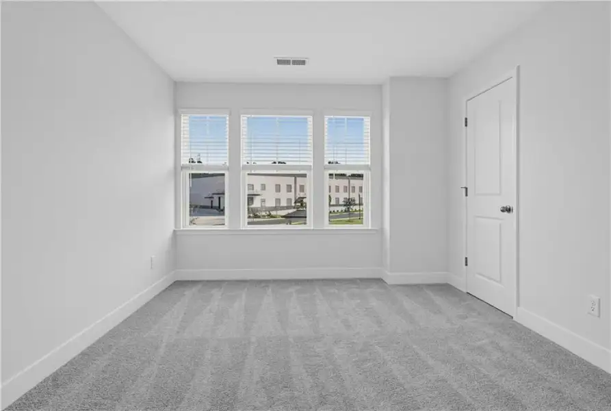 Spacious, unfurnished interior of a new home in Towns at Holly Springs, Holly Springs (Image 20). Spacious, unfurnished interior of a new home in Towns at Holly Springs, Holly Springs (Image 20).