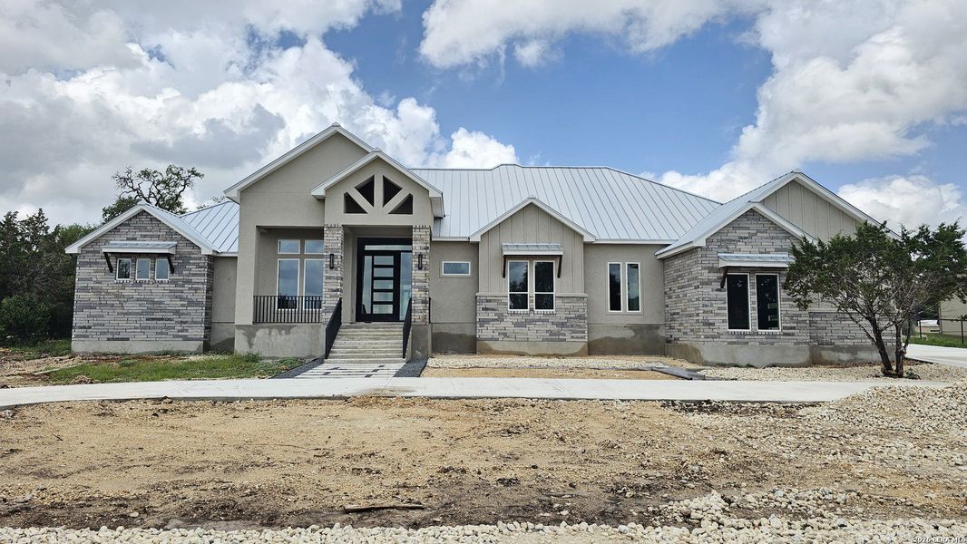 Front exterior of a new home in , New Braunfels, TX, highlighting curb appeal (Image 30).