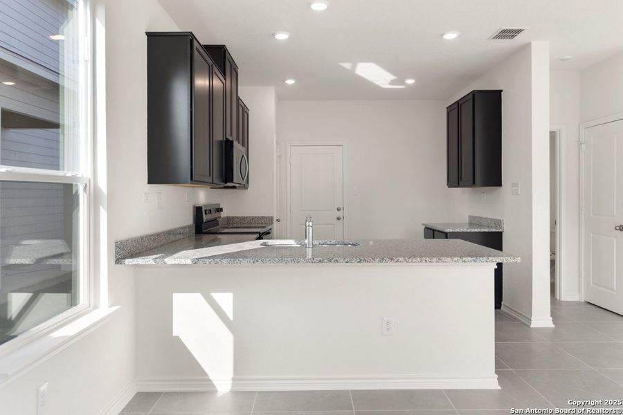Furnished interior view inside a new home in Spanish Trails Villas, San Antonio (Image 6).