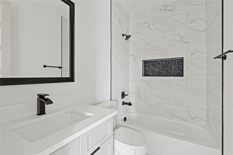 Bathroom featuring vanity and shower / washtub combination Bathroom featuring vanity and shower / washtub combination