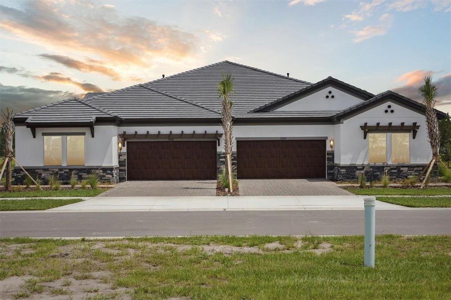 Front exterior of a new home in Two Rivers, Zephyrhills, FL, highlighting curb appeal (Image 16).