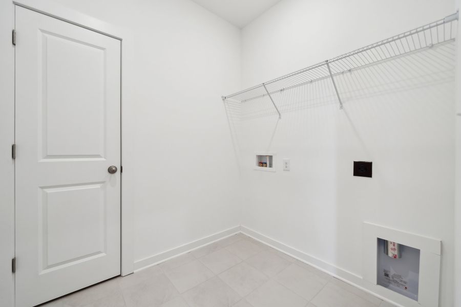 A white room with a white door and a white wall. A white room with a white door and a white wall.