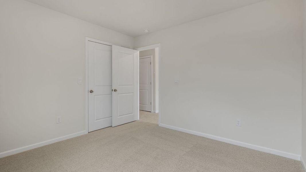 Spacious, unfurnished interior of a new home in The Grove at Matthews Landing, Fuquay Varina (Image 25).