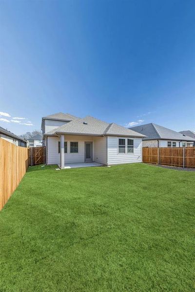 Covered Patio in the Willow home plan by Trophy Signature Homes – REPRESENTATIVE PHOTO