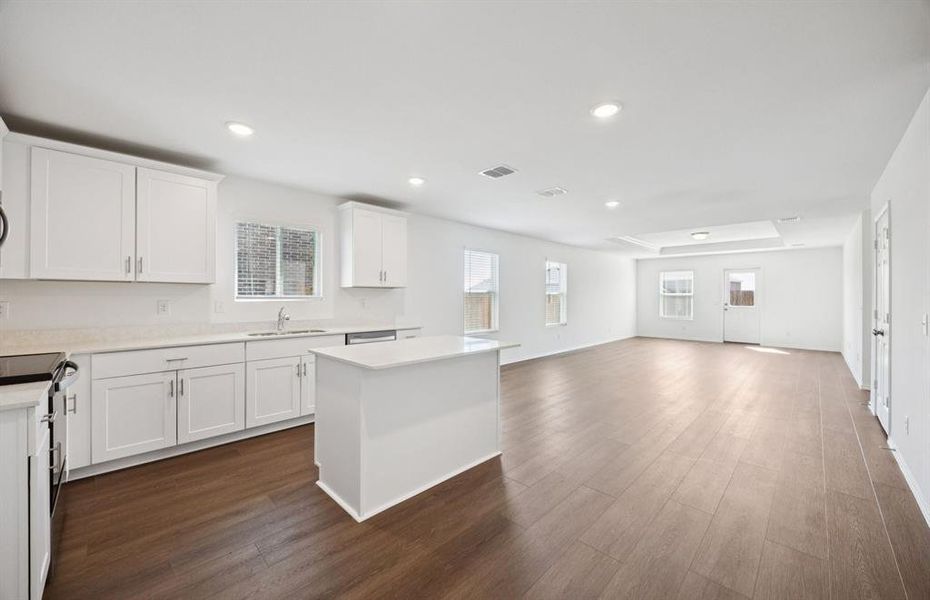 Large island overlooking gathering room and dining areas Large island overlooking gathering room and dining areas