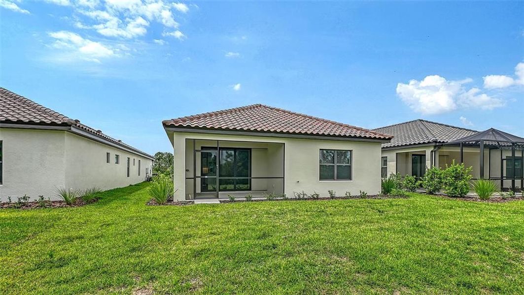 Exterior details and patio area of a home in Vicenza Real Estate and Homes for Sale in North Venice, FL - Neal Communities, Nokomis (Image 18). Exterior details and patio area of a home in Vicenza Real Estate and Homes for Sale in North Venice, FL - Neal Communities, Nokomis (Image 18).