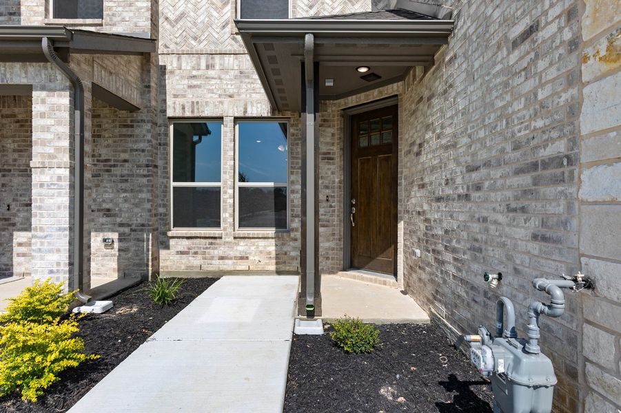 Front exterior of a new home in Timber Ridge, Corinth, TX, highlighting curb appeal (Image 29). Front exterior of a new home in Timber Ridge, Corinth, TX, highlighting curb appeal (Image 29).