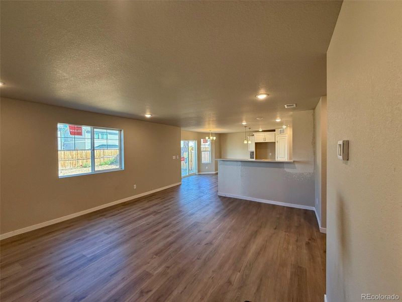 Furnished interior view inside a new home in Sky Ranch - Highland Collection, Watkins (Image 4).