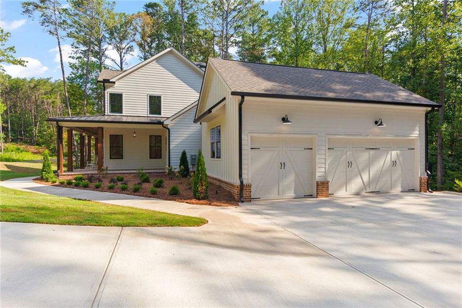 Front exterior of a new home in , Ball Ground, GA, highlighting curb appeal (Image 26).