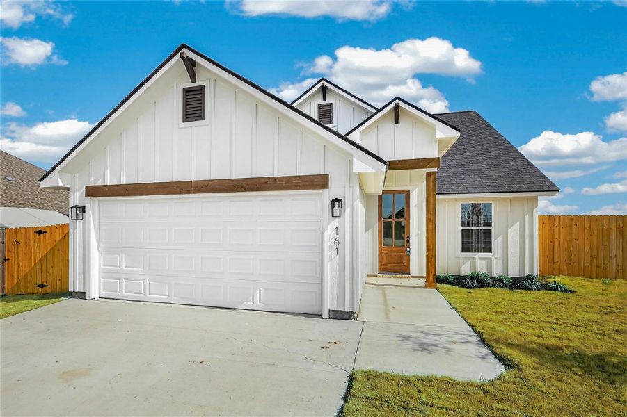 Front exterior of a new home in , Snook, TX, highlighting curb appeal (Image 1). Front exterior of a new home in , Snook, TX, highlighting curb appeal (Image 1).