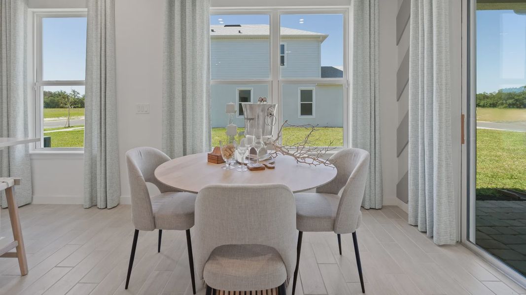 Breakfast area with large double window at a DRB Homes Ambersweet model at the Trinity Place community. Breakfast area with large double window at a DRB Homes Ambersweet model at the Trinity Place community.