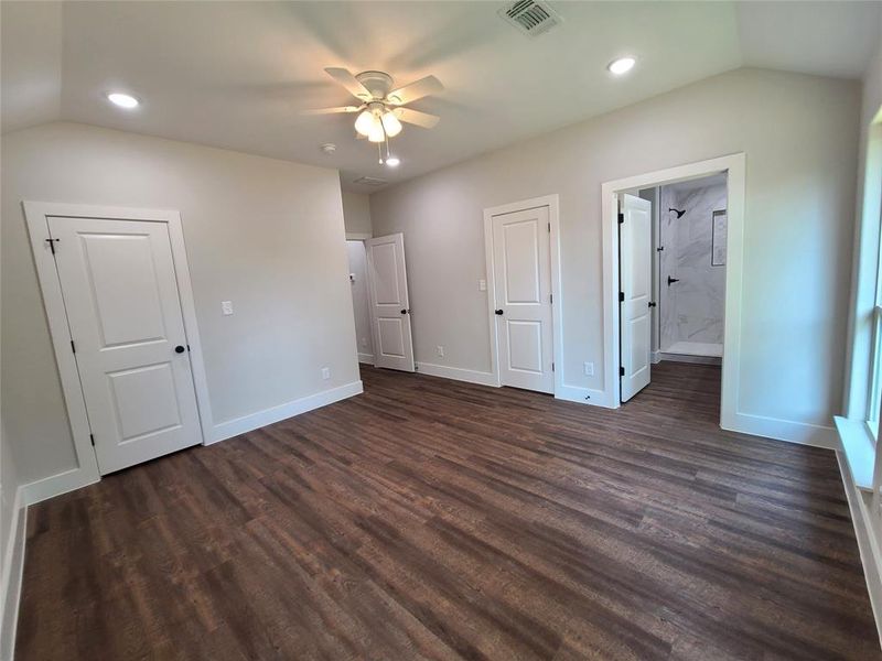 Primary bedroom with  ensuite bathroom, and dual closets.