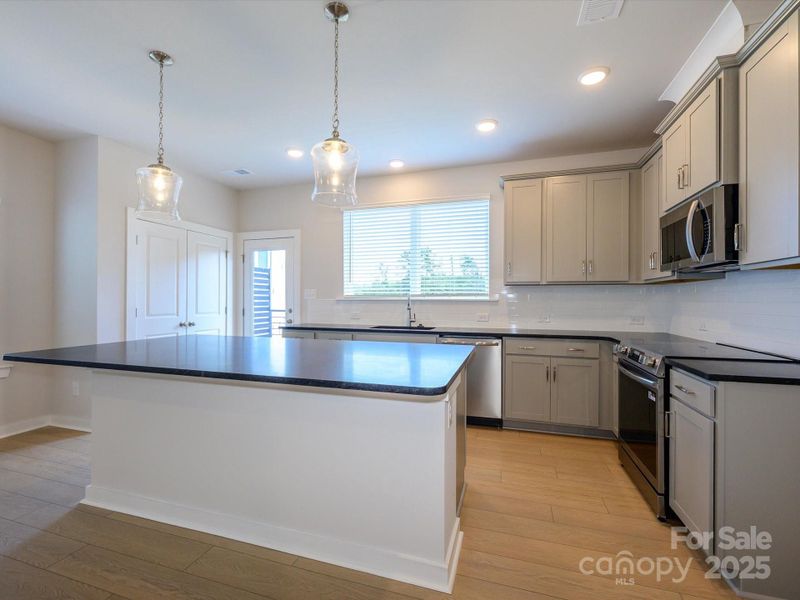 Furnished interior view inside a new home in Central Living at Craig, Charlotte (Image 10).