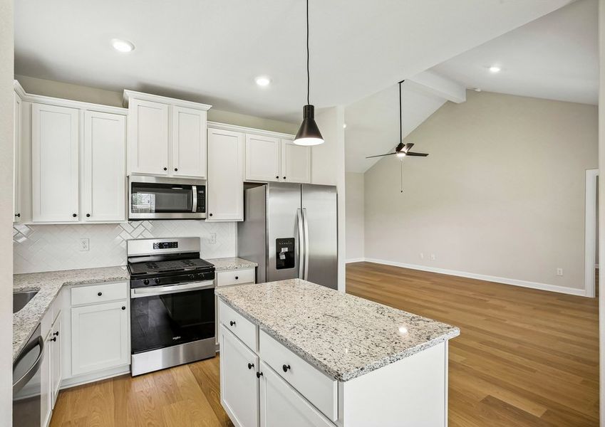 The island provides plenty of space to prep meals. The island provides plenty of space to prep meals.