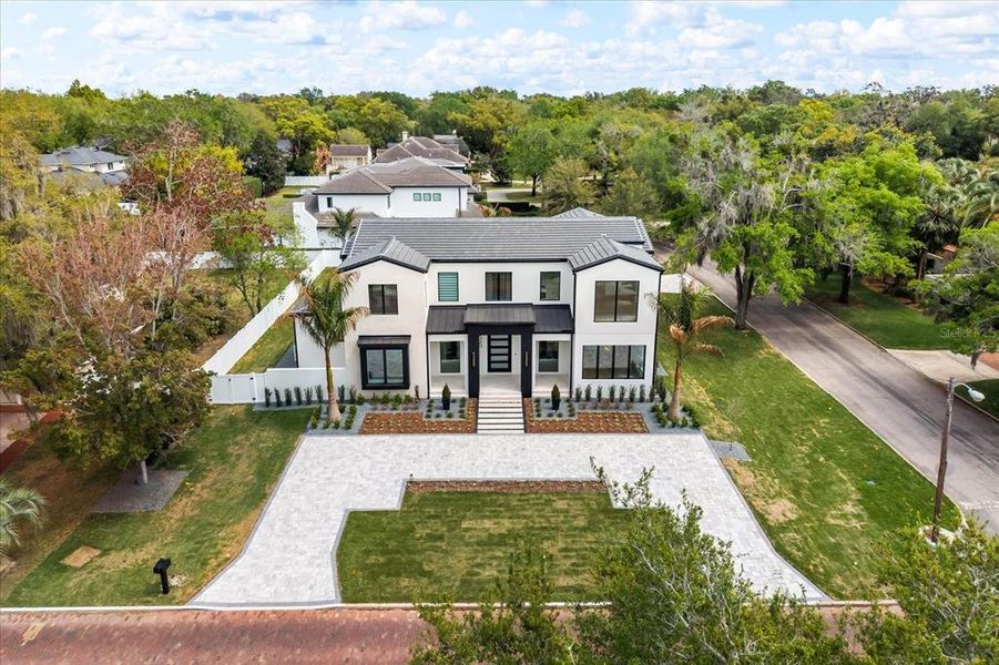 Front exterior of a new home in , Winter Park, FL, highlighting curb appeal (Image 29). Front exterior of a new home in , Winter Park, FL, highlighting curb appeal (Image 29).